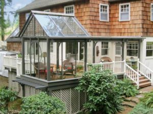 Glass sunroom addition built onto a house